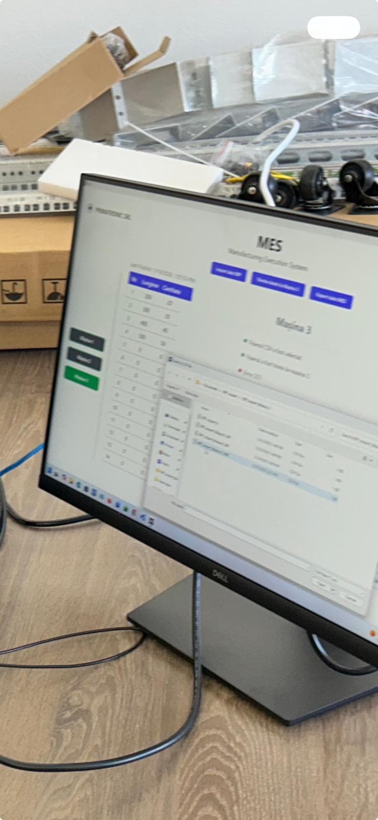 Primatronic MES Manufacturing Execution System dashboard on monitor — real-time production tracking and machine monitoring software