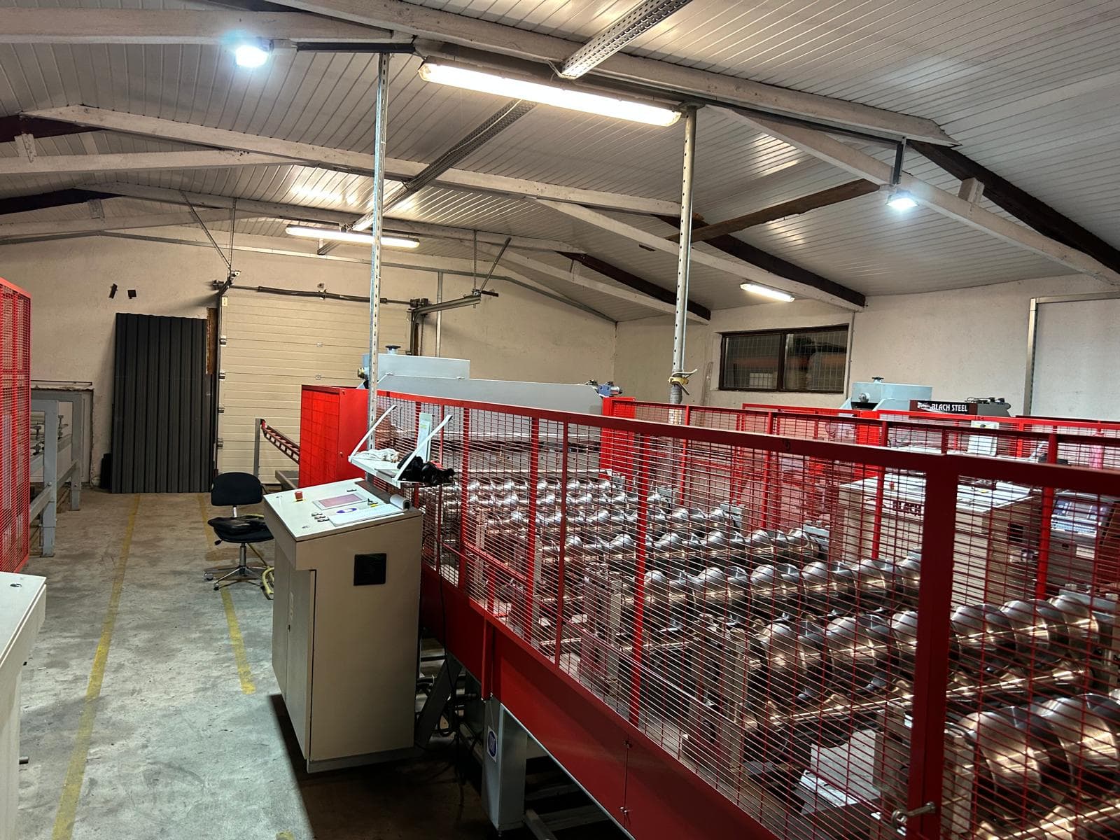 Primatronic factory floor with automated roll forming line and operator control panel — industrial automation Romania